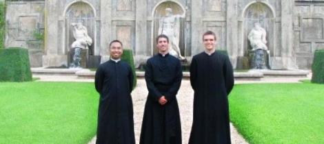 priests in a garden 