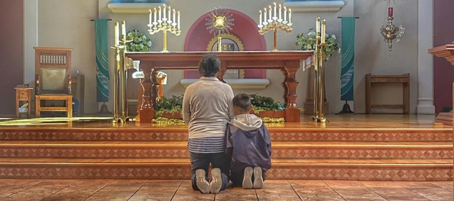 mom and son in prayer