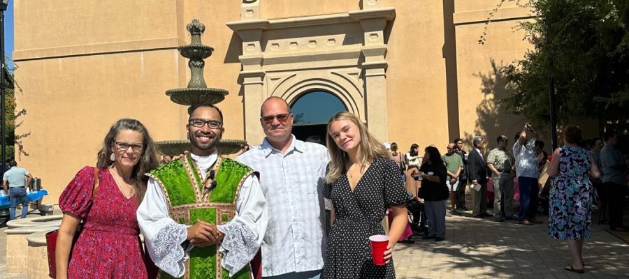 family in front of church 